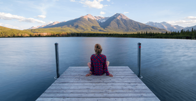 A serene image of a woman sitting peacefully.