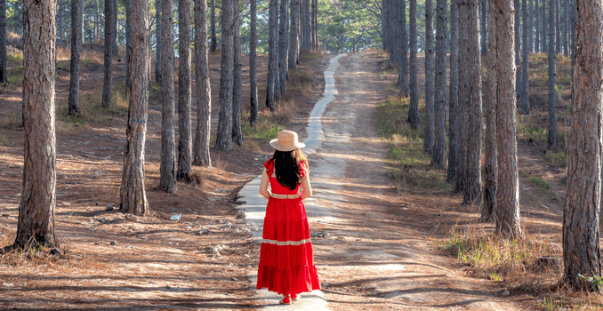 A woman confidently stepping forward on a clear path