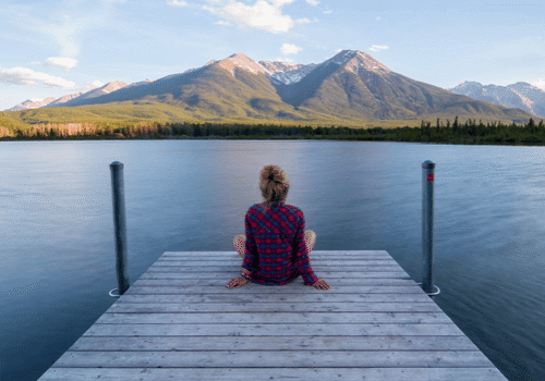 A serene image of a woman sitting peacefully.