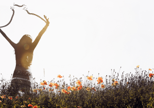 a woman breaking through symbolic chains barriers, with an expression of determination and hope.